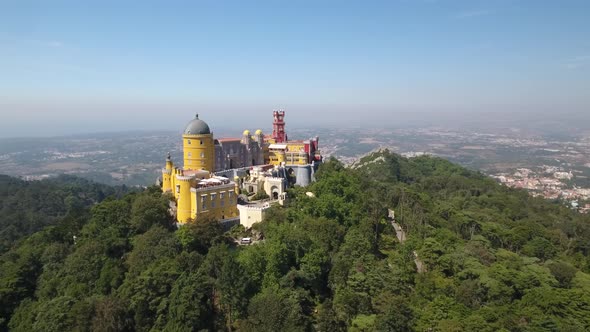 Aerial shot of Pena Palace in Sintra Mountains, Portugal alt
