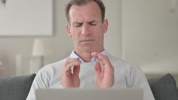 Portrait of Middle Aged Businessman with Headache Working From Home  alt
