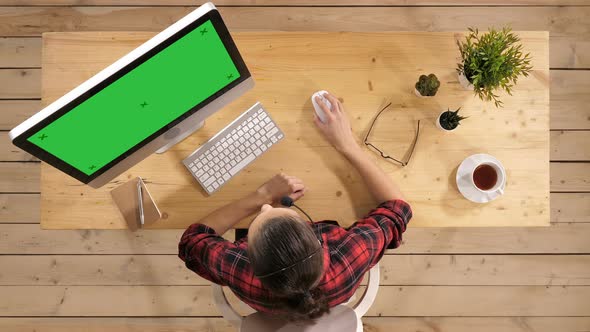 Beautiful Freelancer Female Talking in a Video Conference on Line with a Headset with Microphone and alt