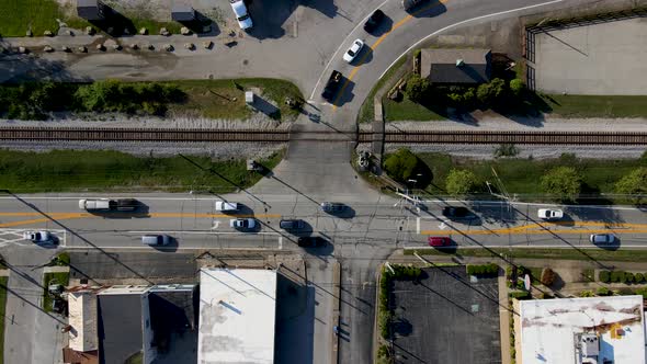 Aerial/Drone footage of Intersection with Cars, Railroad Tracks, Vertical Fall