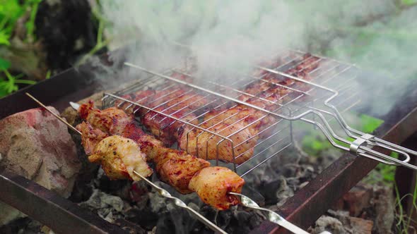 Grilling Meat on Coals in a Garbage Can Closeup
