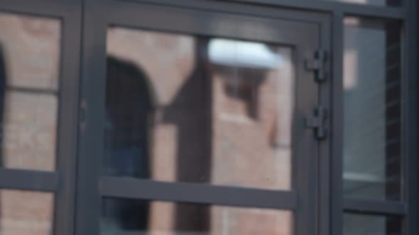 Pensive Businessman Coming and Standing in Front of Office alt