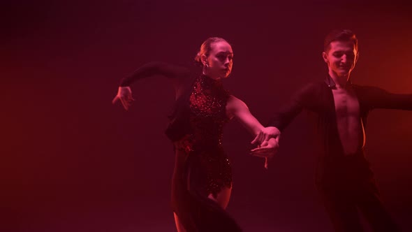 Graceful Couple Performing Latin Dance Indoors alt
