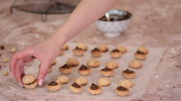 The process of making Italian biscuits Baci di Dama.