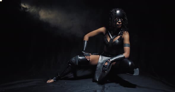 Strong Female Character Superhero Catwoman Is Squatting on the Floor alt