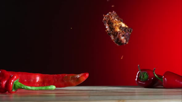 Smoked chicken wings falling and bouncing in ultra slow motion 1500fps - CHICKEN WINGS PHANTOM  alt