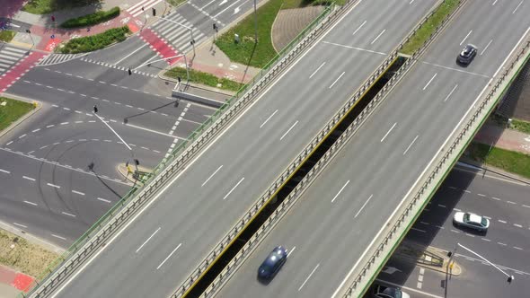 Highway aerial with cars and truck lorrying aerial view 4k. Four lane local road traffic transport v alt