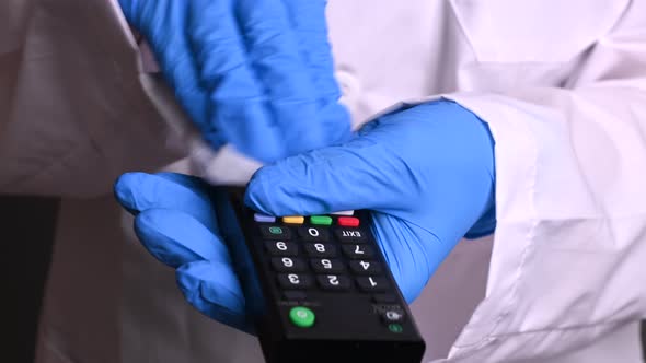 People Disinfects the TV Remote. Protect Your Home From Viruses and Diseases. Epidemic Covid-19