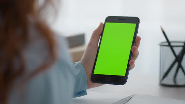 Zoom in Shot of Unrecognizable Little Girl Holding Smartphone with Green Chroma Key Screen and alt