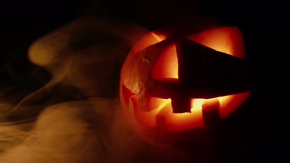Scary Old Jack-o-lantern on Black Background alt