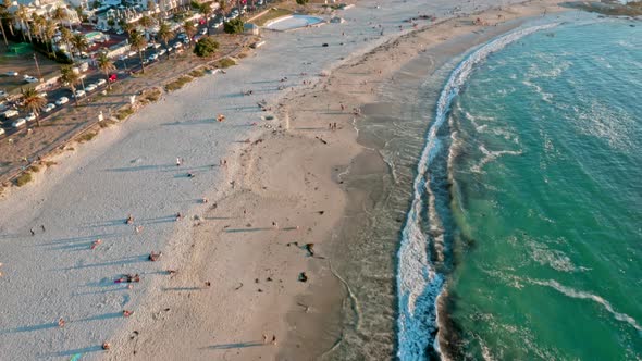 Aerial View the Inviting Blue Water of Camps Bay Beach at Sunset