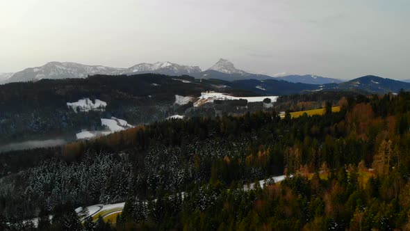 Drone Video with Mountein and Forest and Village in the Winter alt