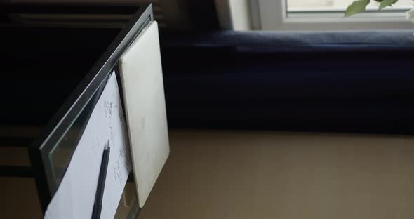 girl hands open lid of a laptop with a green screen and types on the keyboard alt