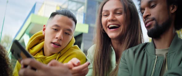Video of group of best friends sitting with mobile phone. Shot with RED helium camera in 8K alt