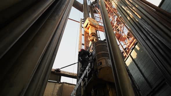 Top Drive System TDS and Derrick of Oil Drilling Rig
