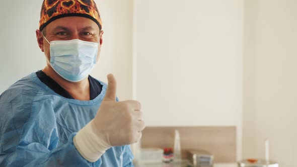 Portrait of the Professional Surgeon Looking Into Camera and Smiling After alt