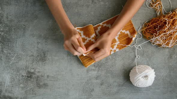 adult girls hands crochet hook