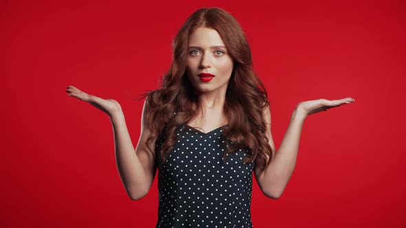  Young Unsure Girl Shrugs Arms, Makes Gesture of I Don't Know, Care, Can't Help alt