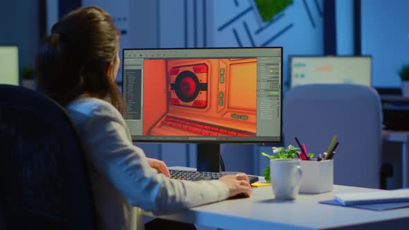 Woman Game Sotware Developer Testing New Game Overtime at Night alt