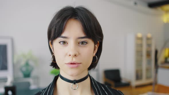 Smiling Young Brunette Woman Girl in Casual Clothes Posing on Cozy Home Background alt
