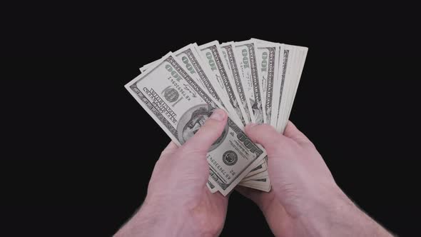 Male Hands Counting Lot of 100 American Dollar Banknotes Fan with Alpha Channel alt