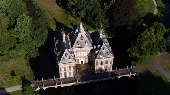 Panning drone shot of the lavish Duivenvoorde Castle, one of the oldest castles in South Holland, su alt
