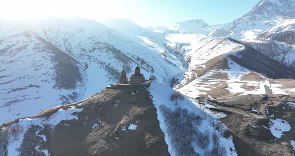 Aerial view of Gergeti Trinity Church, Tsminda Sameba in Kazbegi. Georgia 2022 alt