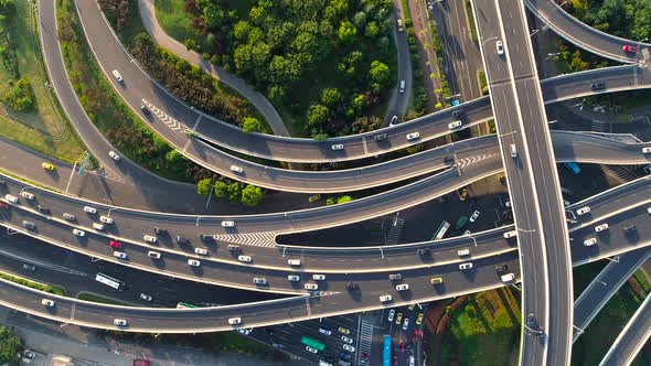 Aerial view of highway and overpass in city alt