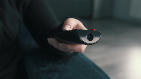 Close Up of Woman Hand Switches Channels Watch Tv at Home Cinematic alt