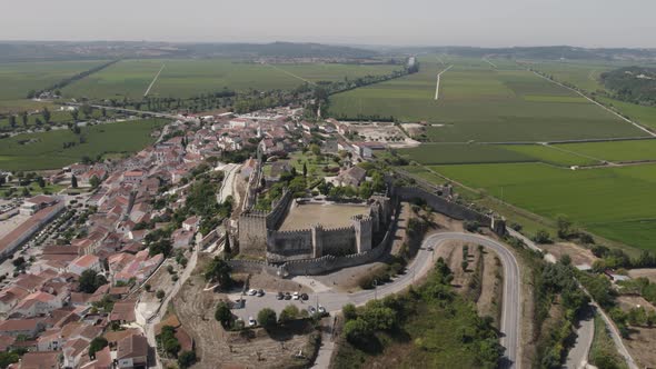 Hilltop castle of Montemor-o-Velho overlooking countryside, Portugal; drone