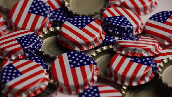 Rotating shot of bottle caps with the American flag printed on them - BOTTLE CAPS alt