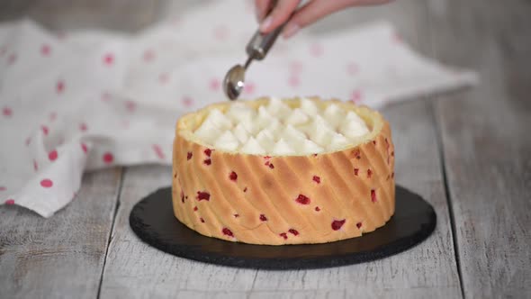 Chef Decorating Raspberry Mousse Cake