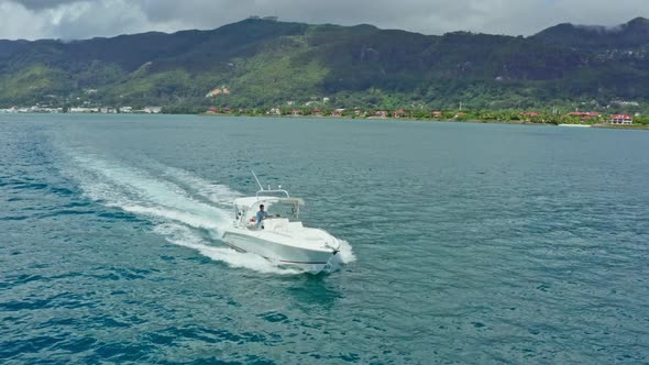 Aerial View of a Motor Boat Sailing on Blue Ocean Water alt