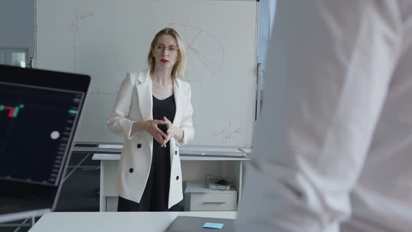 Young Girl Explains the Working Process for Her Coworkers alt