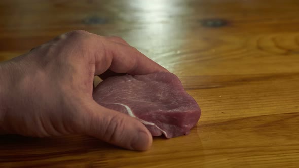 piece of Pork or beef meat preparing on a table in stop motion