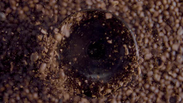 Rotating Coffee Beans Grinding in Mill Close Up alt