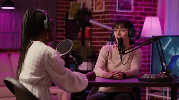 Content Creator Recording Podcast with Famous Influencer for Social Media Page alt