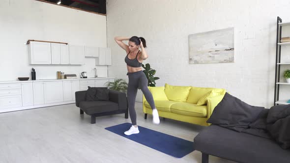 Beautiful Young Woman Doing Fitness at Home alt