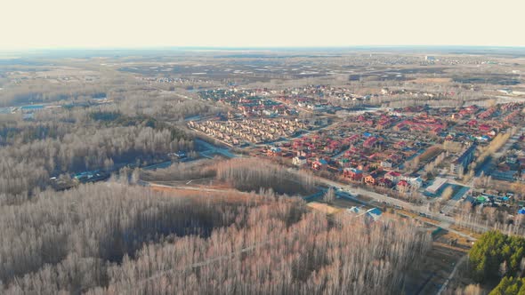 Drone Flight in a City Park on the Outskirts of a Small Town alt
