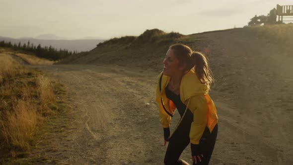 Happy Sports Woman Jumping on Trail alt
