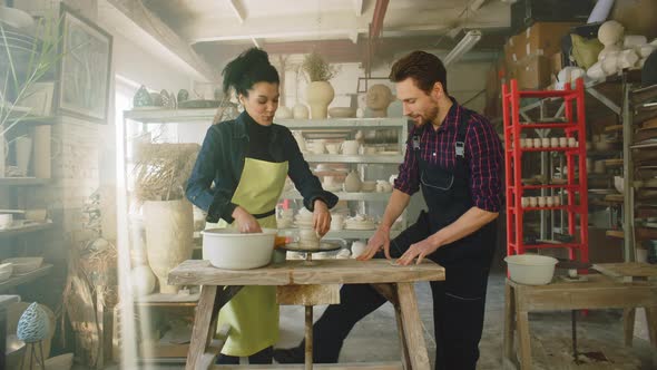 Young Couple Is Working In Pottery