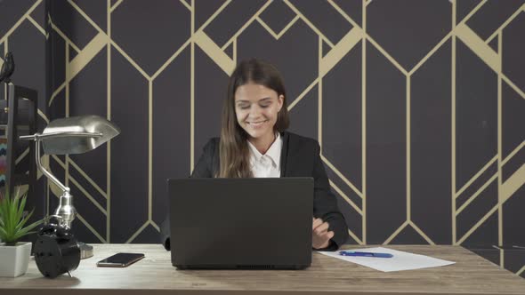 Smiling western business woman, white person working from home with computer notebook laptop alt