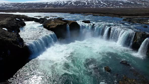 Drone flying over Northern Iceland Godafoss Waterfall in Spring alt