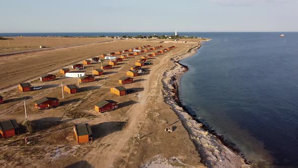 Bird'seye View of a Campsite Consisting of Wooden Houses on the Western Coast of Crimea Peninsula alt
