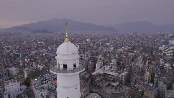 Flying near the top of the Dharahara Tower viewing Kathmandu alt