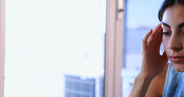 Female executive suffering form headache alt