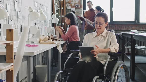 Disabled Fashion Designer with Tablet alt