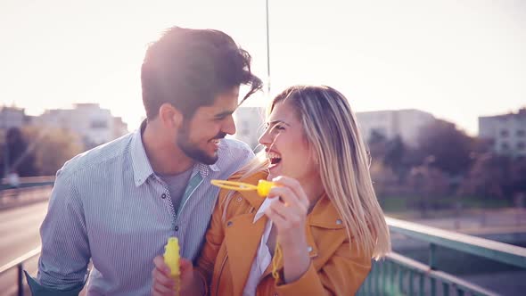 Romantic Young Couple in Love Hugging on the Street alt