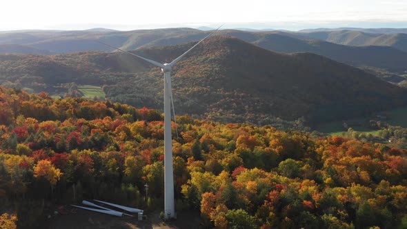 Electric Windmill turbine wind farm aerial clean energy colorful hills in autumn alt