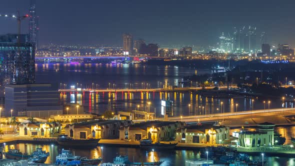 Dubai Creek Landscape Night Timelapse with Boats and Ship Near Waterfront alt